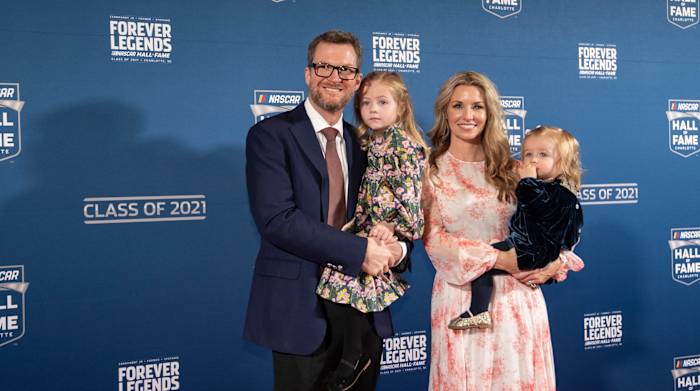 NASCAR Hall of Fame inductee Dale Earnhardt Jr., left, poses for photos prior to the induction ceremony on Friday, Jan. 21, 2022, in Charlotte, N.C.